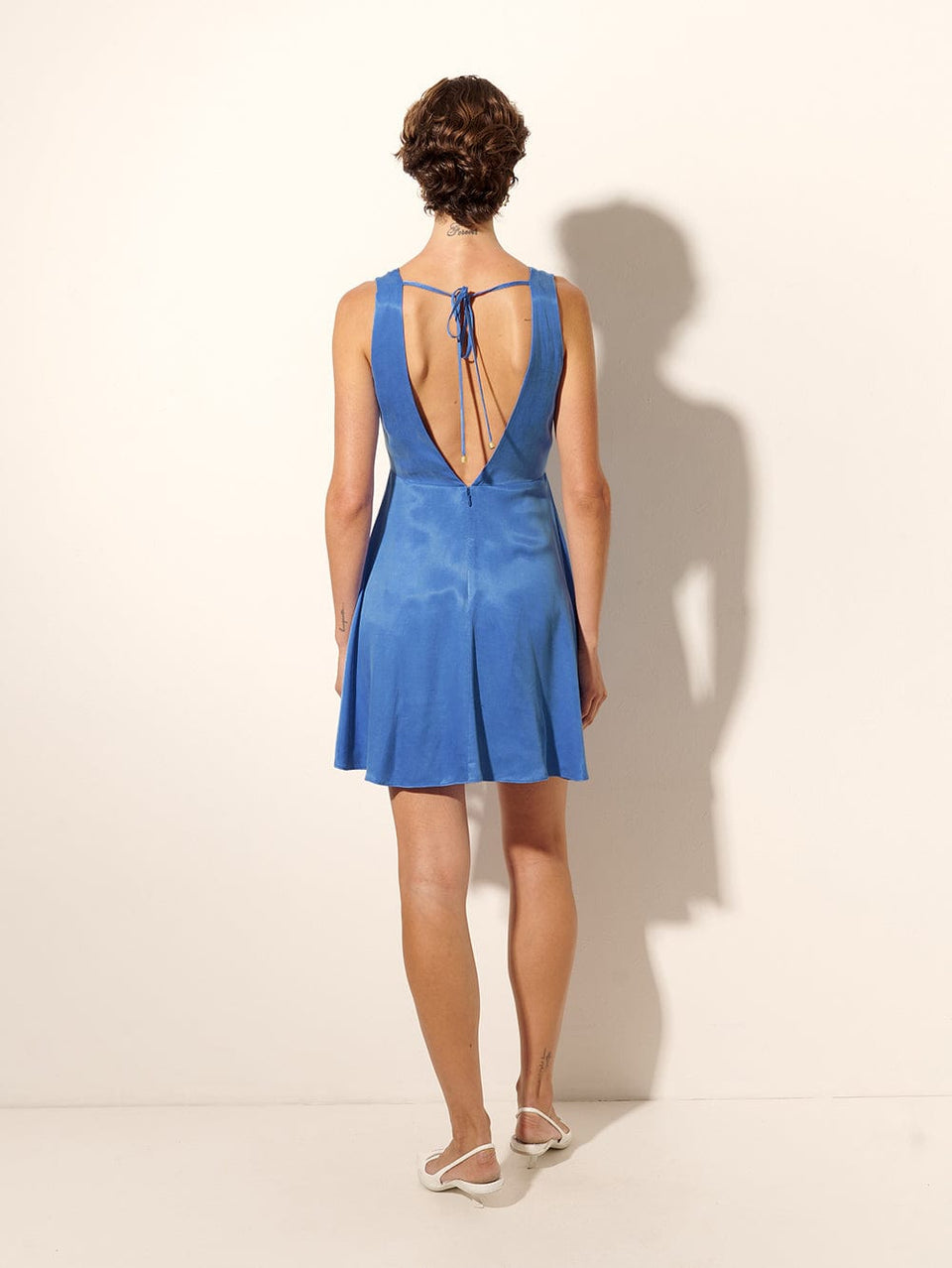 Raya Mini Dress KIVARI | Model wears blue mini dress back view