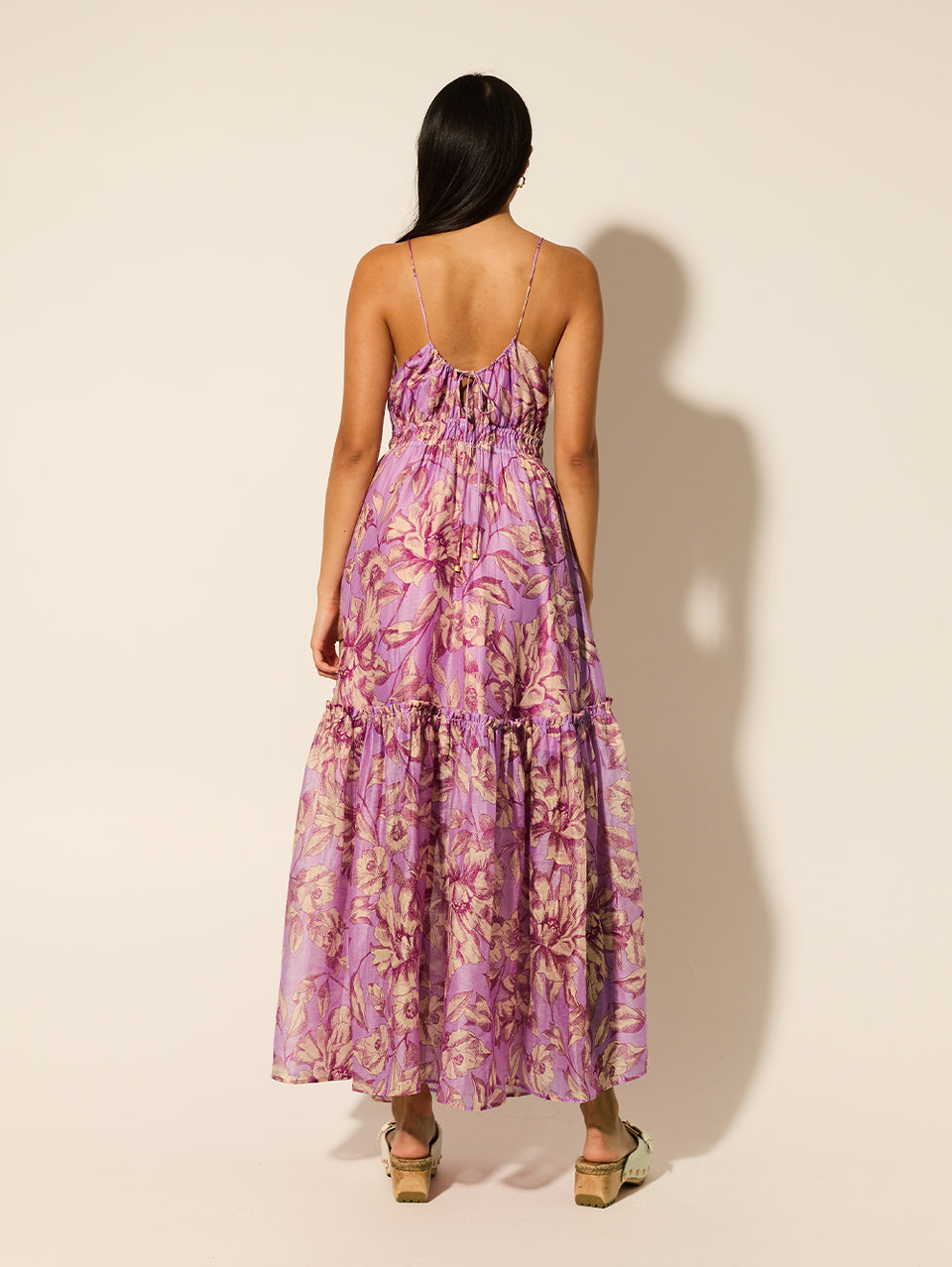 Reyna Maxi Dress KIVARI | Model wears purple floral maxi dress back view