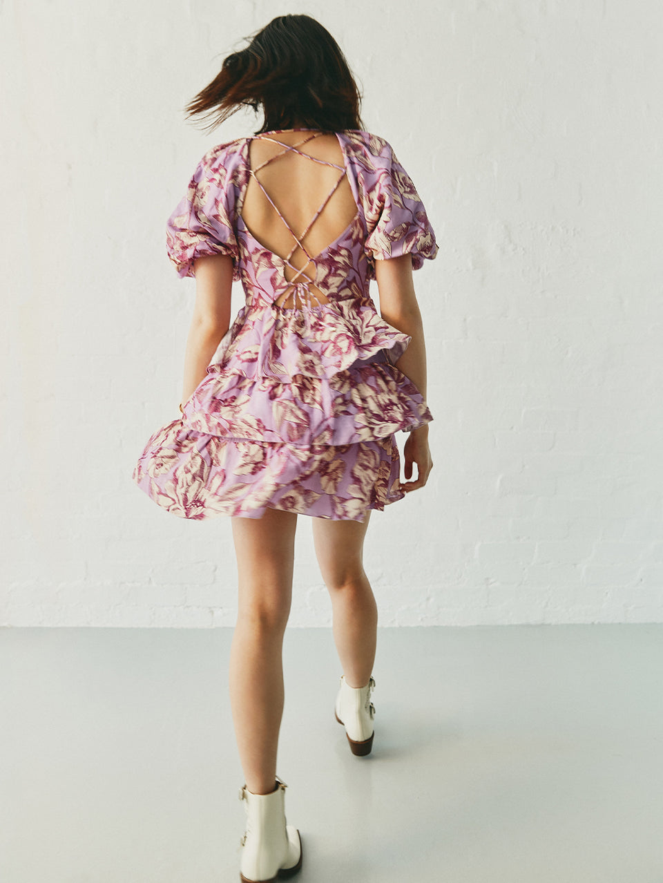 Reyna Mini Dress KIVARI | Model wears purple floral mini dress campaign