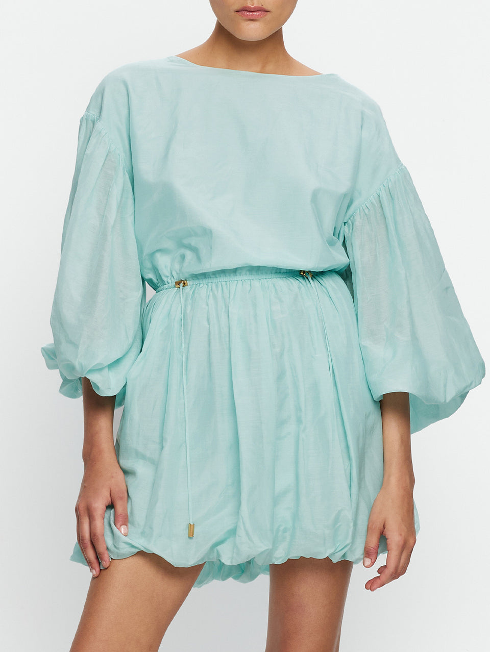 Light blue dress with ruffled sleeves on a white background
