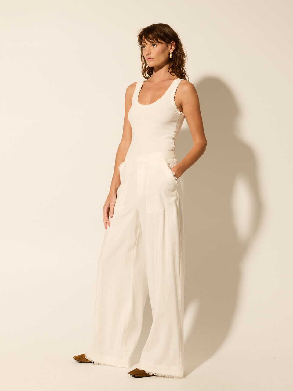 Rocio Pant KIVARI | Model wears cream tailored pant side view