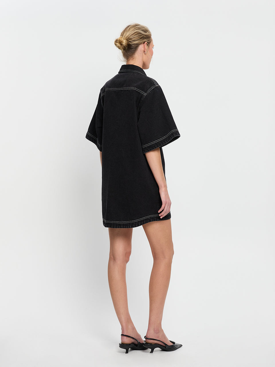 Rowyn Shirt Dress Black KIVARI | Model wears black denim shirt dress back view