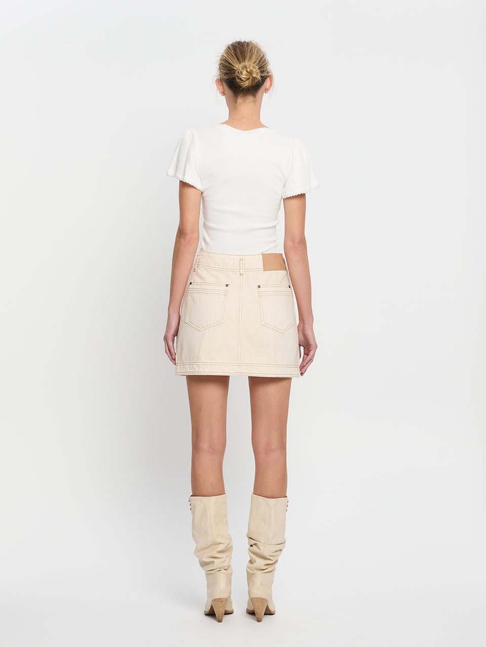 Rowyn Skirt Cream KIVARI | Model wears cream denim skirt back view