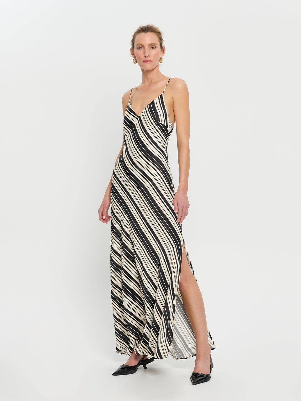 Sara Slip Dress KIVARI | Model wears stripe slip dress side view