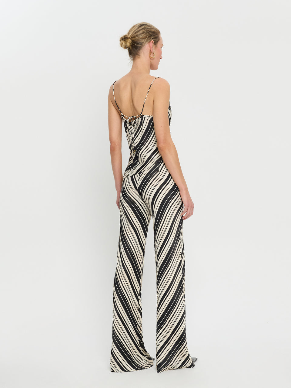 Sara Top KIVARI | Model wears asymmetrical stripe top back view