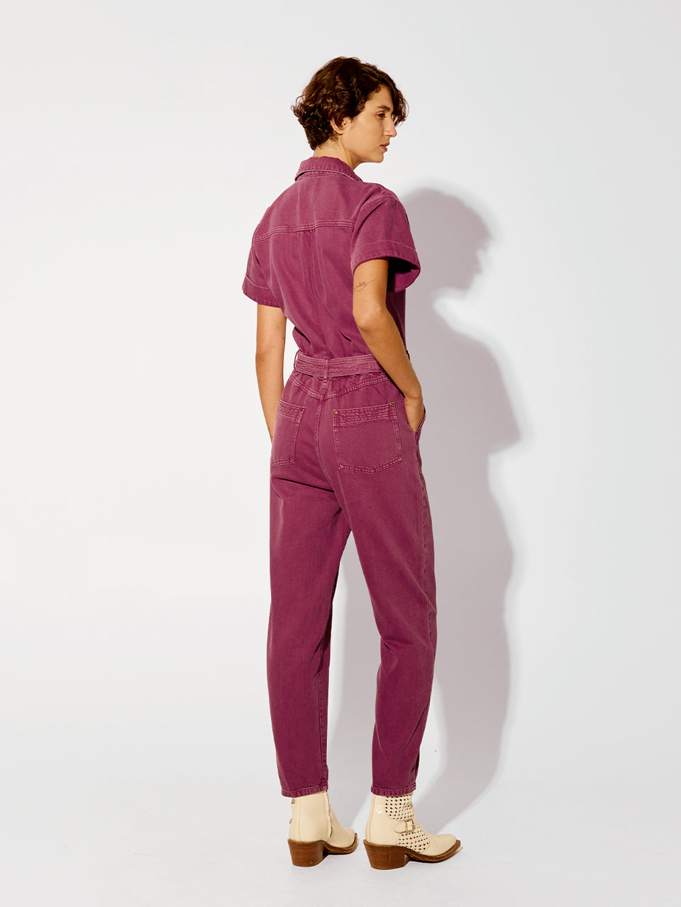 Tahlia Boilersuit Burgundy KIVARI | Model wears purple denim boilersuit back view