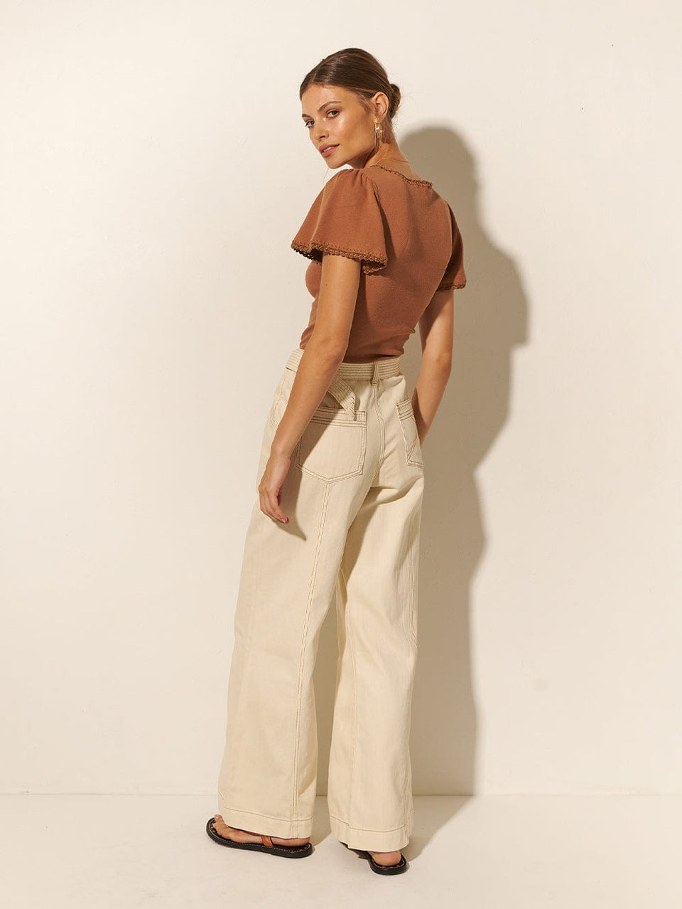 KIVARI Tallulah Tee | Model wears Brown Tee Back View