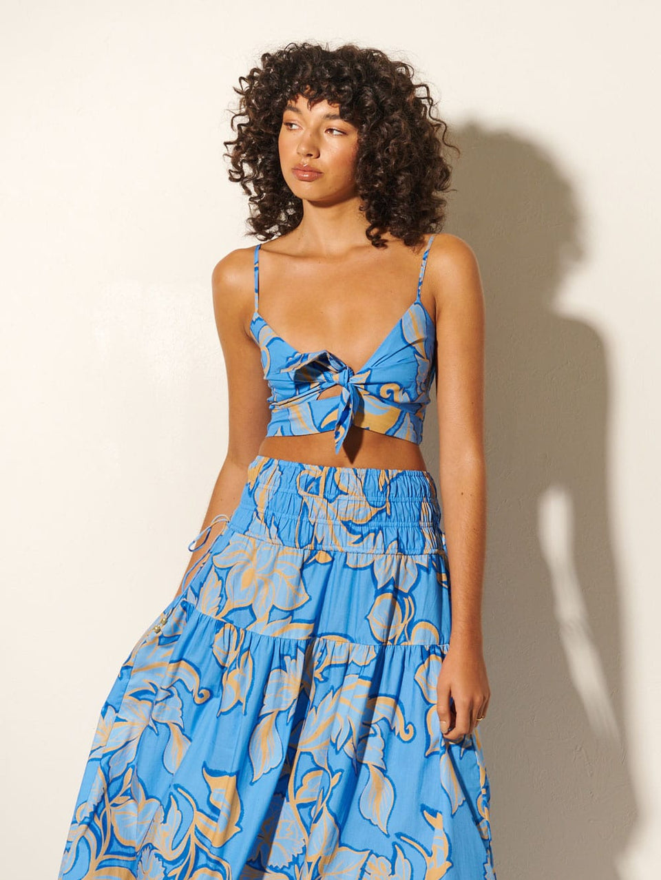 Taniana Crop Top KIVARI | Model wears blue floral crop top with matching skirt close up
