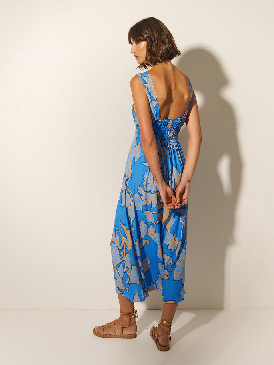Taniana Midi Dress KIVARI | Model wears blue and orange floral midi dress back view