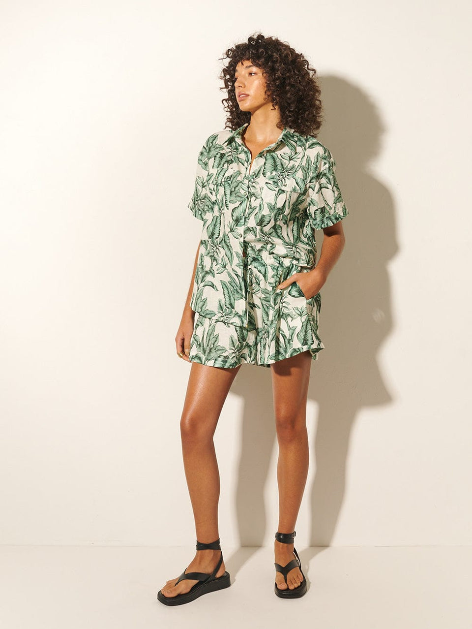 Tropico Shirt KIVARI | Model wears palm leaf print shirt side view