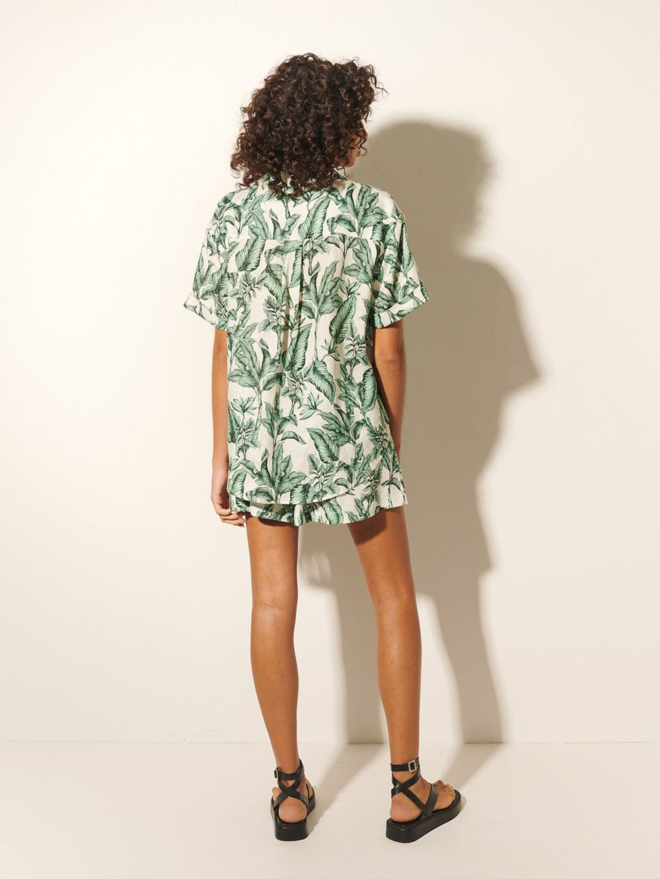 Tropico Shirt KIVARI | Model wears palm leaf print shirt back view