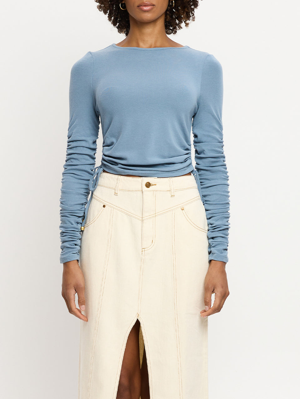 Vanessa Top KIVARI | Model wears blue jersey knit long sleeve top