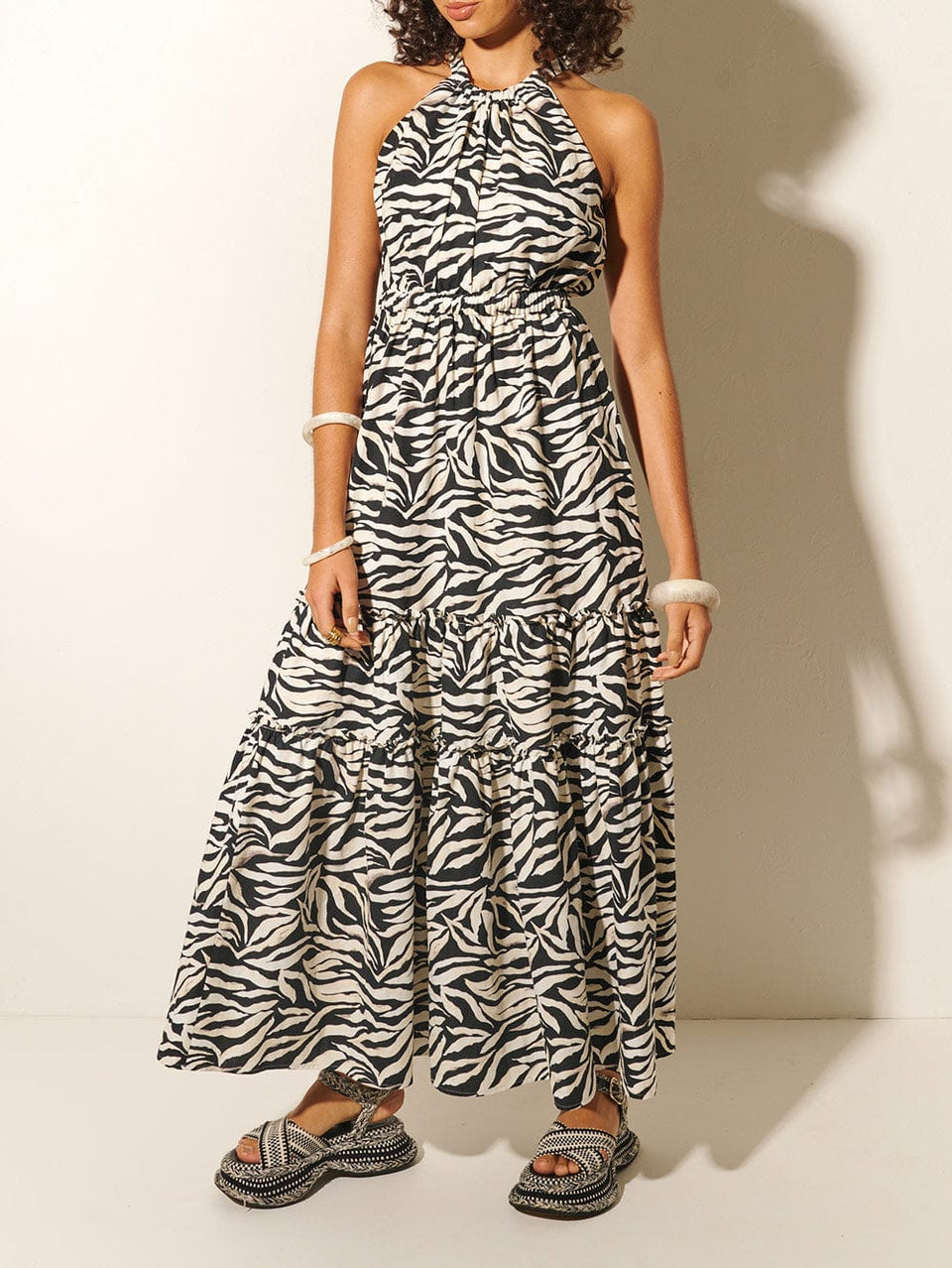 Zenya Halter Maxi Dress KIVARI | Model wears zebra printed halterneck maxi dress