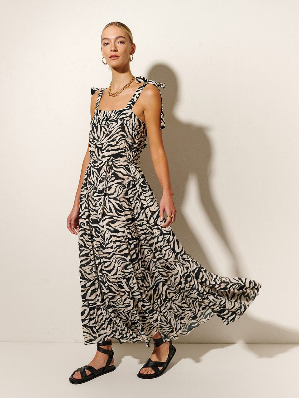 Zenya Maxi Dress KIVARI | Model wears Zebra printed maxi dress side view